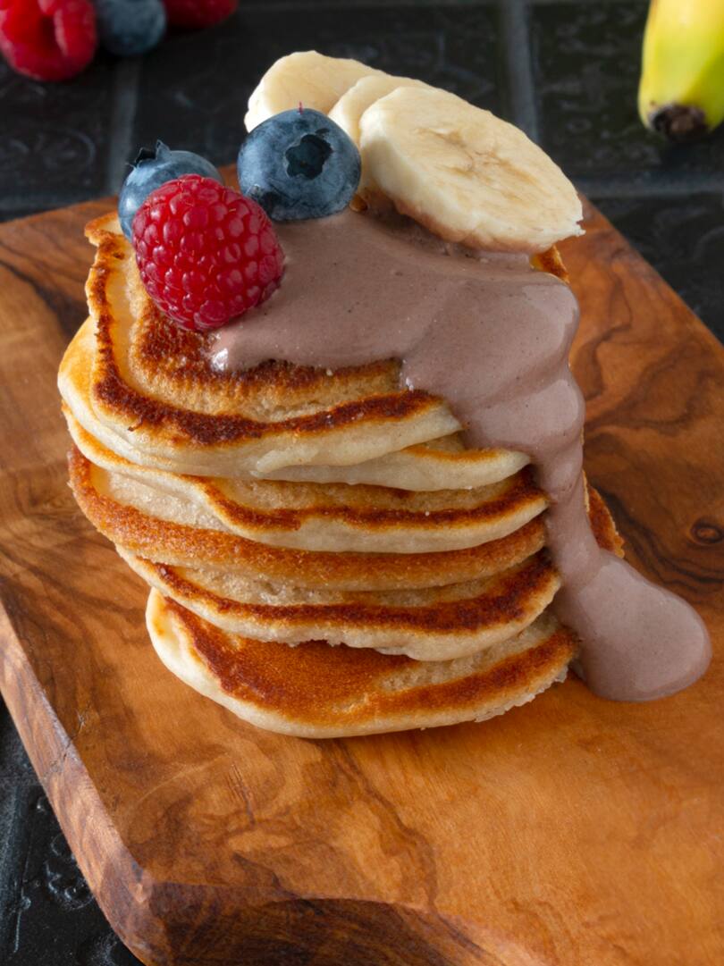 Vegan pancakes with chocolate cream and berries