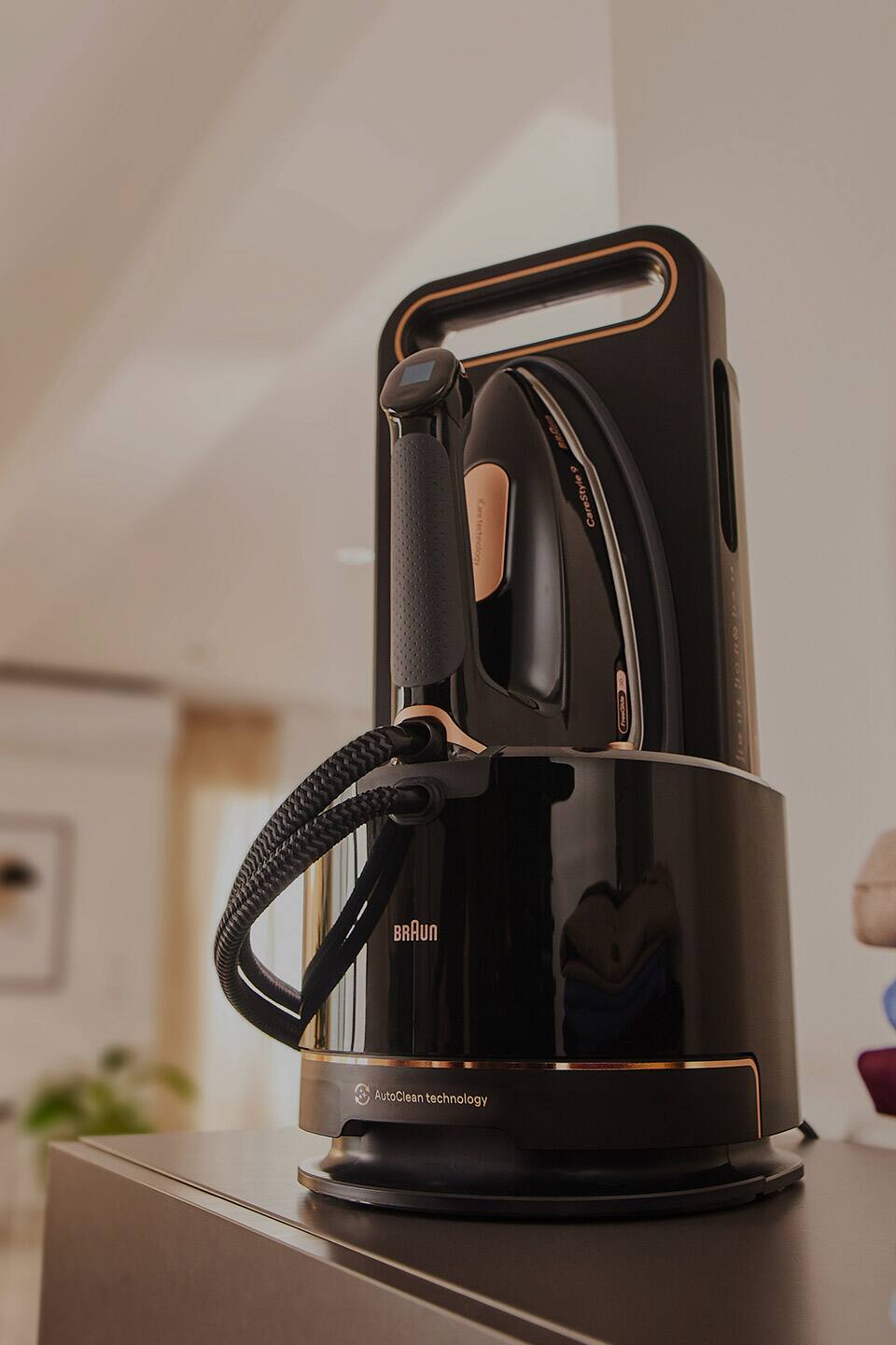 Braun CareStyle 9 steam generator iron standing vertically on a sideboard